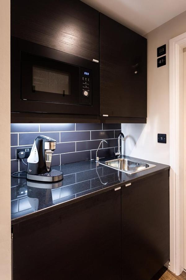 Kotel Windermere Exterior foto A Nespresso coffee machine in a kitchen